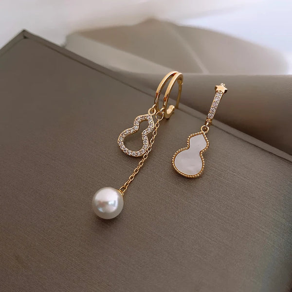 اقراط نسائيه بشكل هندسي لؤلؤ